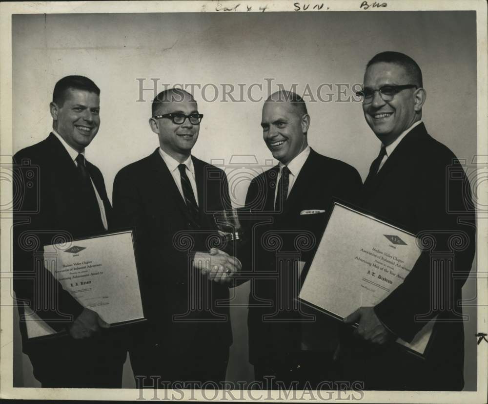 1968 Robert A Winter (2nd L) shakes hands with others at award event - Historic Images