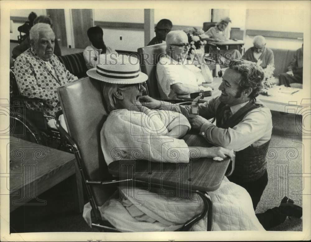 1974 Charlie DiMara interviews women sitting at nursing home - Historic Images