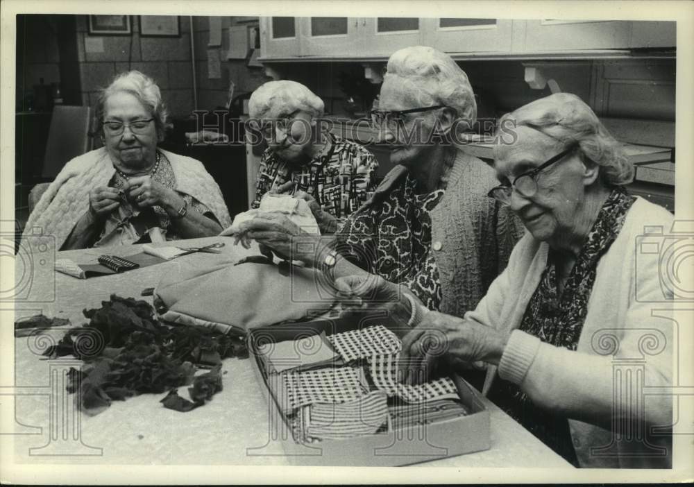 1975 Ladies make patchwork pillows filled with cut nylon stockings - Historic Images