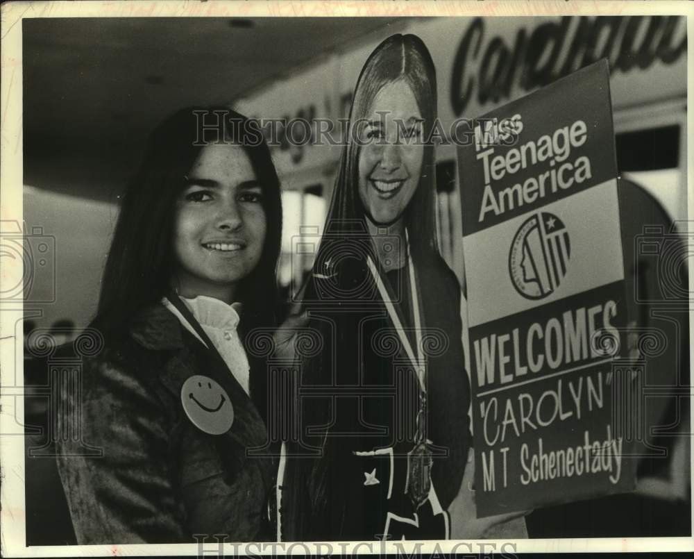 Carolyn Severino stands next to Miss Teenage America display - Historic Images