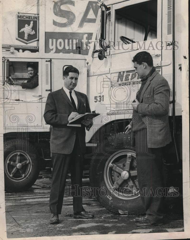 1964 Officials read results of tests at Weinberg Tire, Albany, NY - Historic Images