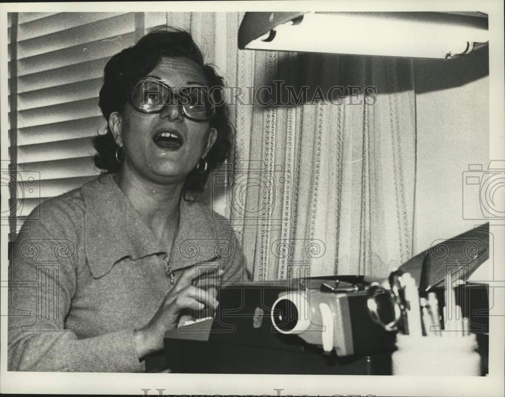 1979 Author Athena Lord typing in her Albany, New York home - Historic Images