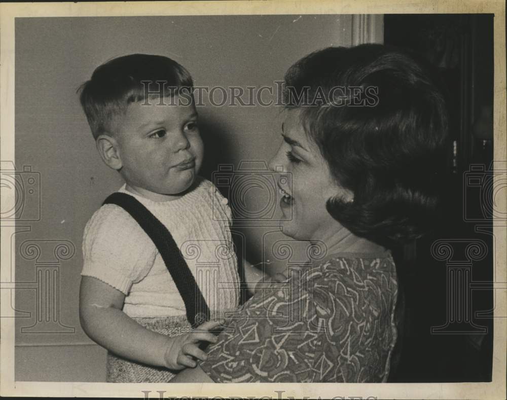1968 Mrs. James A. Shepard holding a young boy in New York - Historic Images