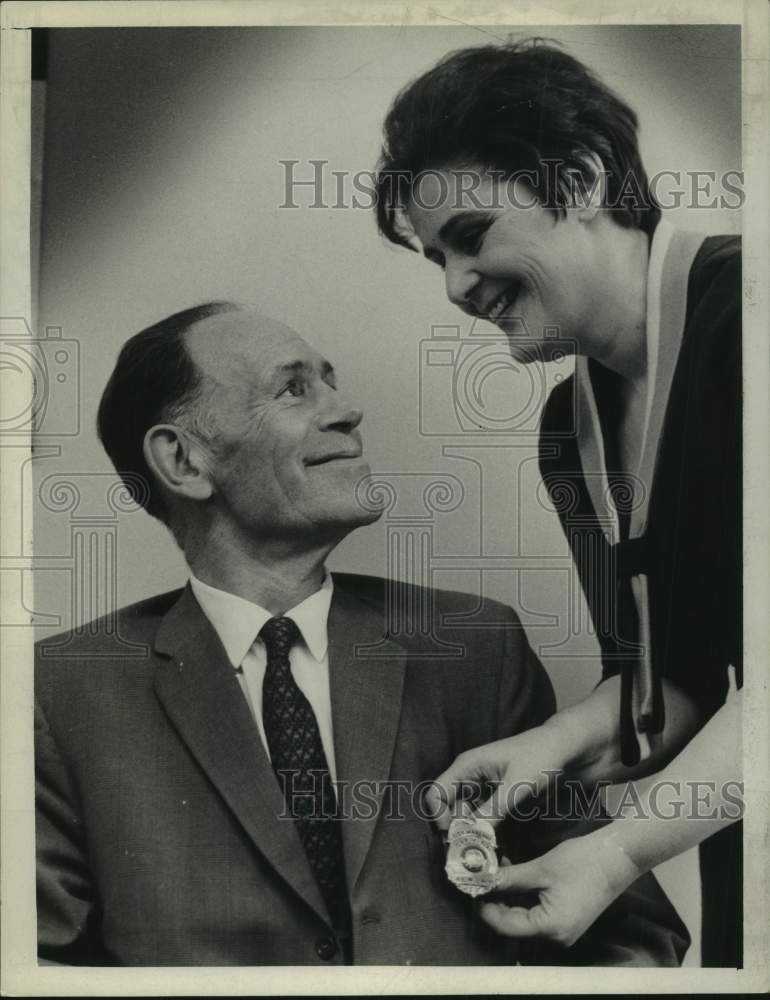 1970 Press Photo Retired US Postmaster receives badge from daughter, Albany, NY - Historic Images