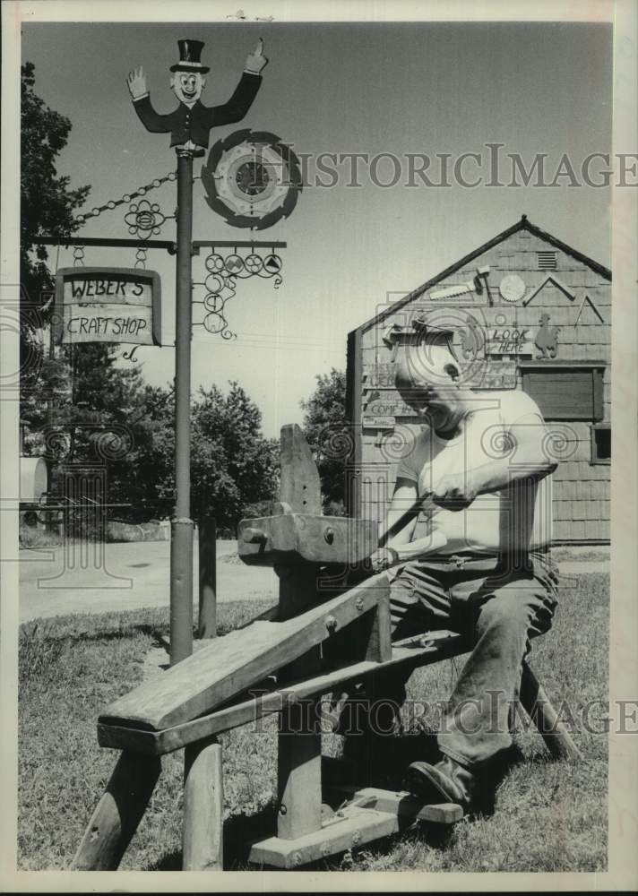 1974 Carl Webber using antique vise at his New York craft shop - Historic Images