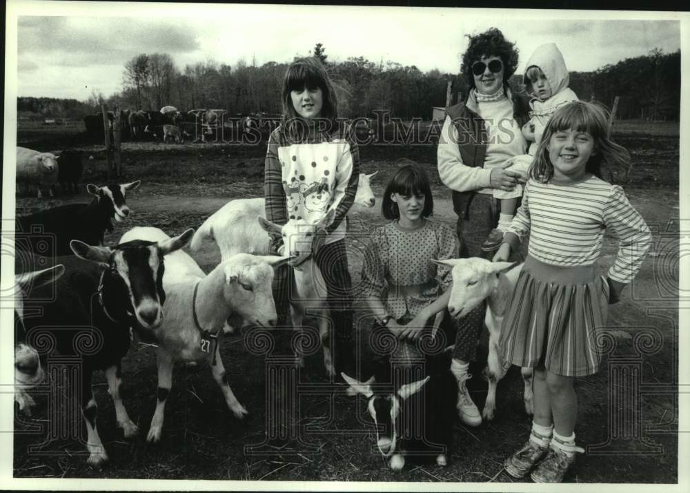 1990 Karen Lindsey with children & goats at Clifton Park, NY farm - Historic Images