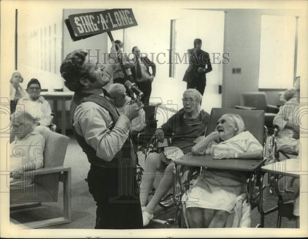 1974 Charlie Di Mora sings to senior citizens in Albany, New York - Historic Images