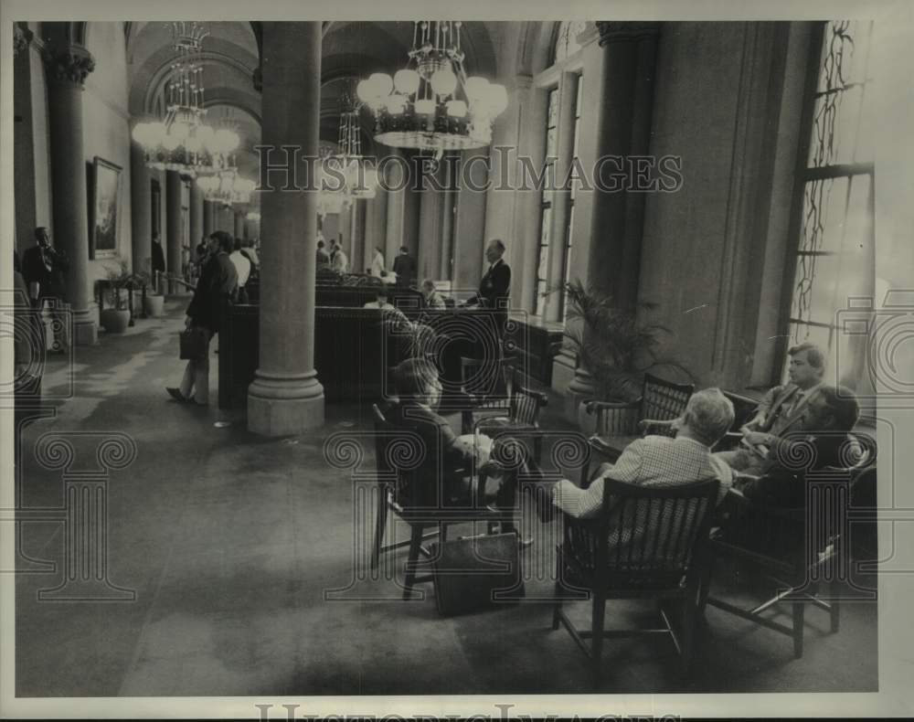 1984 Lobbyists wait in lobby of New York State Senate in Albany - Historic Images