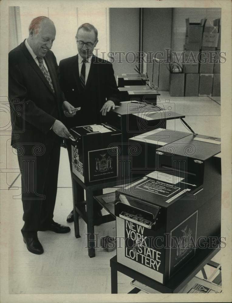 Norman Gallman & Ernest Bird with New York Lottery vending machines - Historic Images