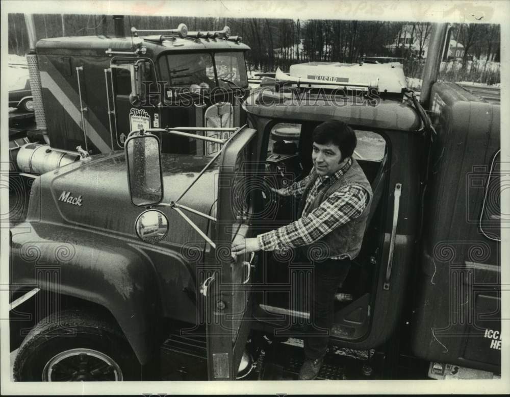 1983 Richard Lucia exits truck after long haul in Alplaus, New York - Historic Images