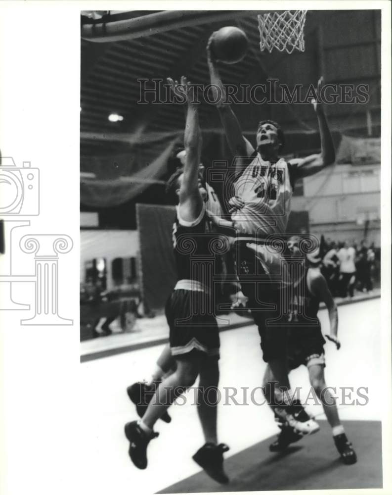 Union College basketball player Mark Stodden shoots over defender - Historic Images