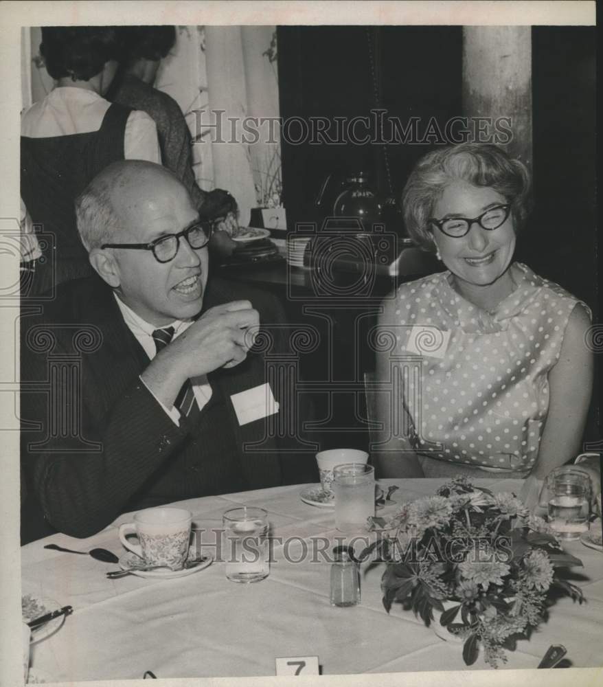 1963 Thomas C Mendenhall &amp; Mrs Joseph Mintzer sit together at event - Historic Images