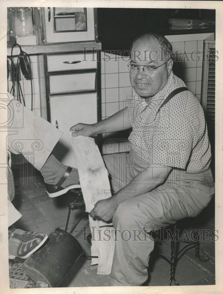 1963 Jimmy Liuzzi shines shoes at Albany, New York barber shop - Historic Images