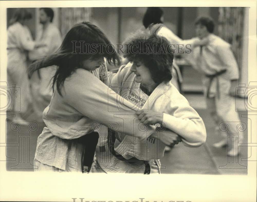 Mary Lewis works out with Lynn Roethke in Judo practice at CSR - Historic Images