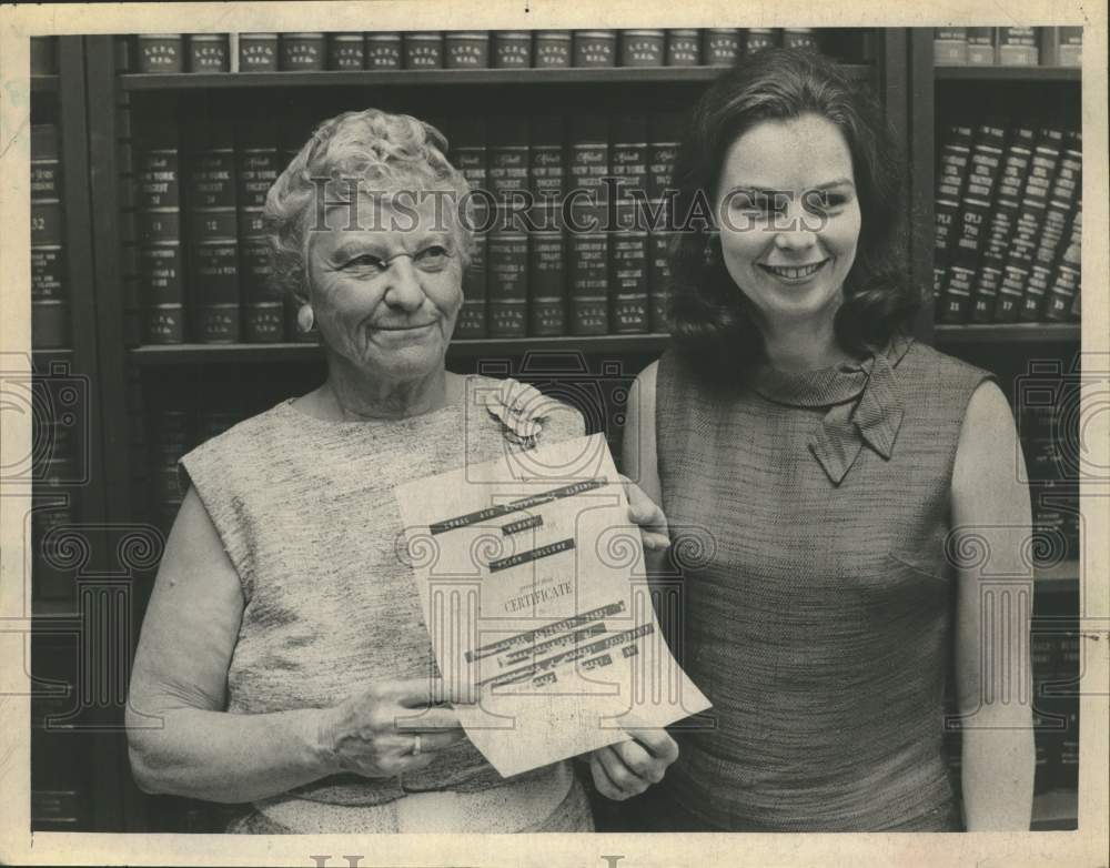 1968 Ruth Miner poses with student and fellowship award in New York - Historic Images