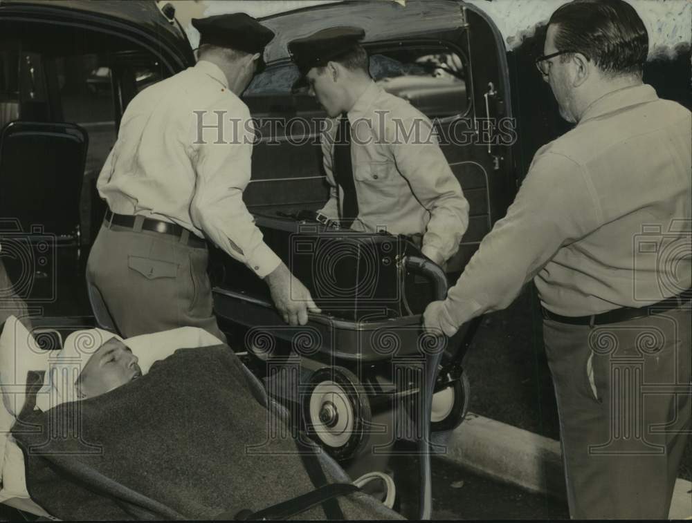 1951 Polio patient with iron lung loaded into vehicle in Albany, NY - Historic Images
