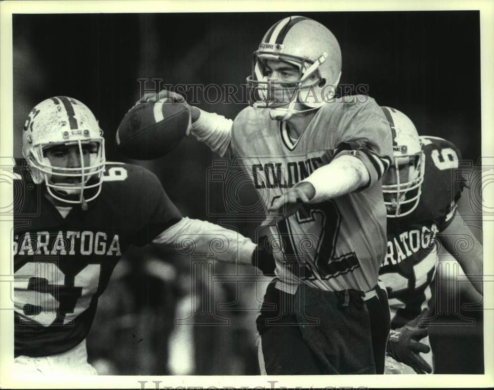 Press Photo Colonie football player #12 attempts to throw ball against Saratoga- Historic Images