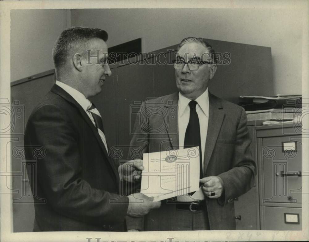 1971 Donald G Gunther presents service award to David W Mitchell - Historic Images