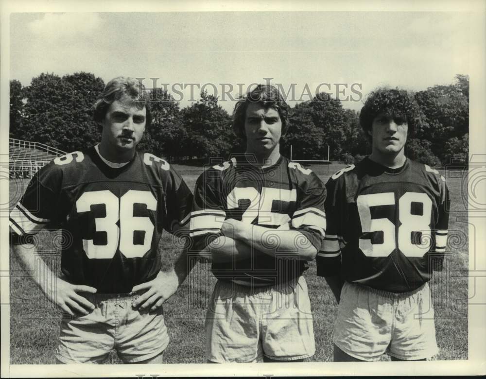 Union College (NY) Football players #36, #25, and #58 pose for photo - Historic Images