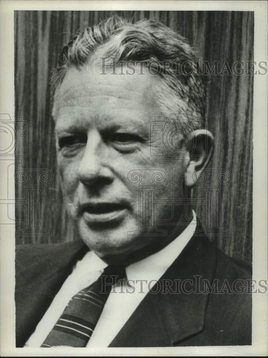1957 Secretary of Defense Neil H McElroy listens during meeting - Historic Images