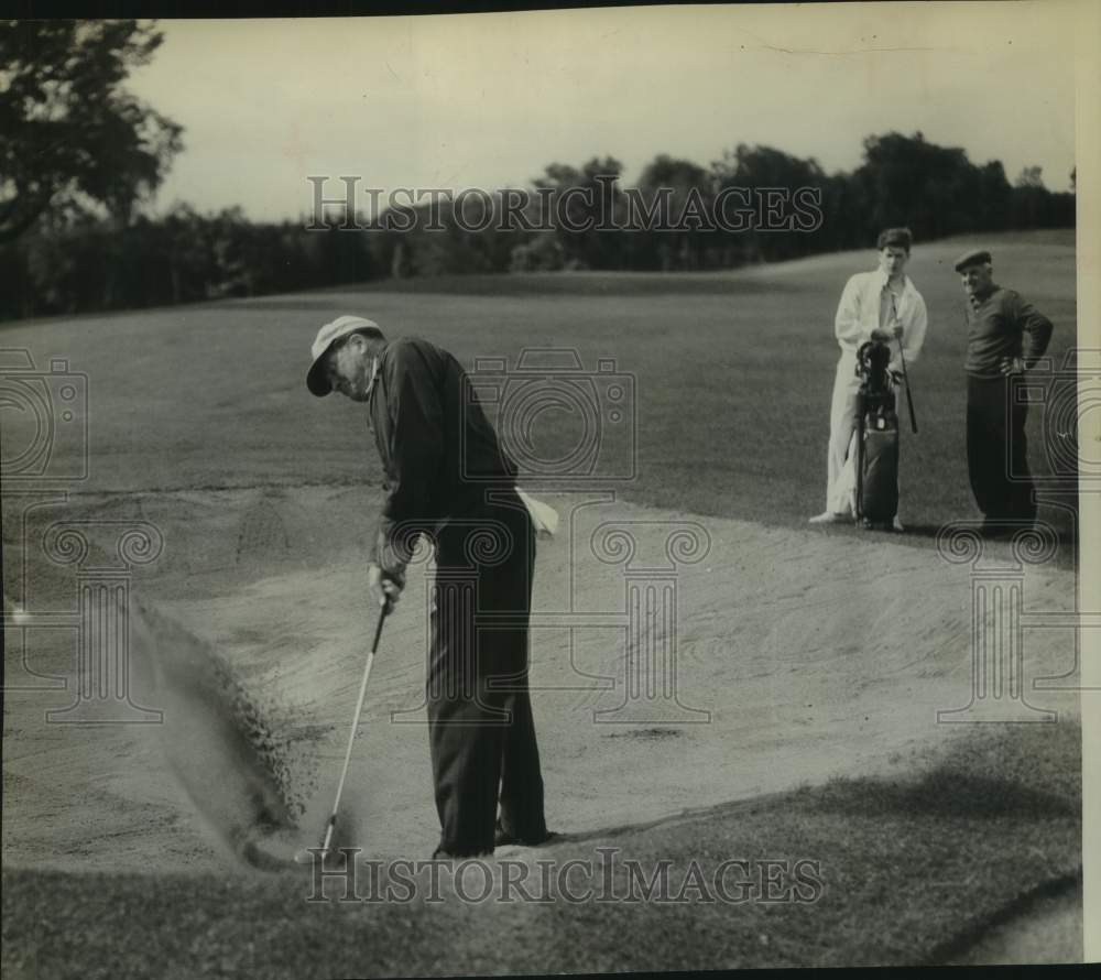 1963 Press Photo J. Weir McHugh hits from sand during round of golf in New York- Historic Images
