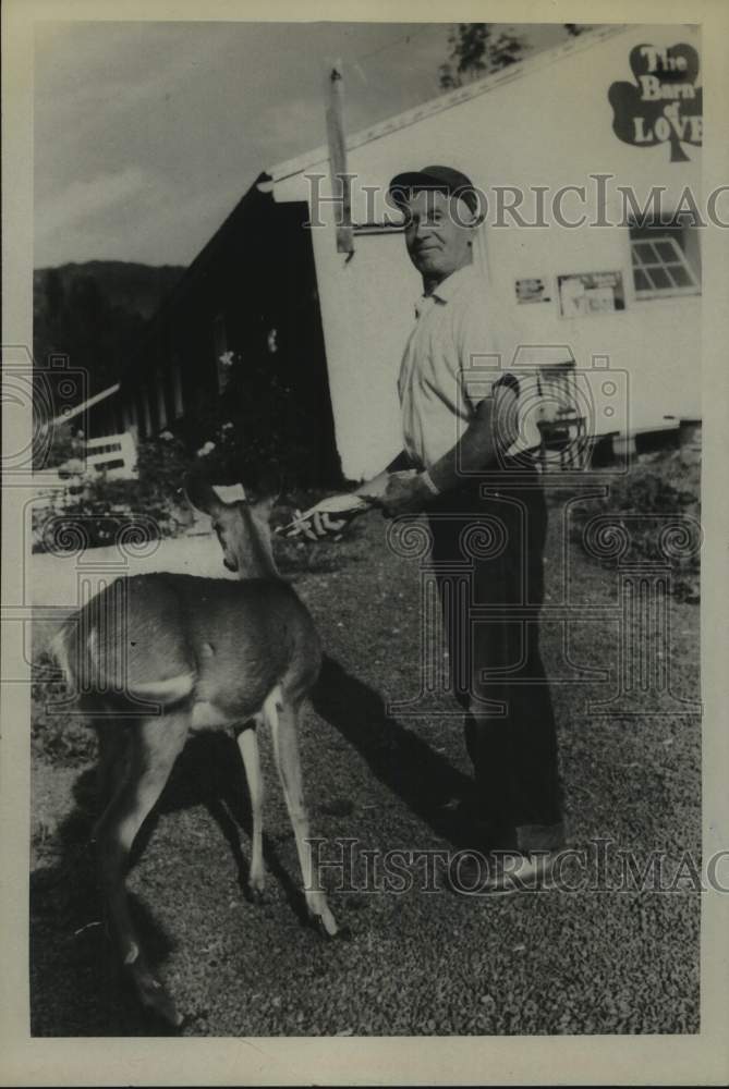 1961 Joe McDonagh with deer on his Corwallville, New York farm - Historic Images