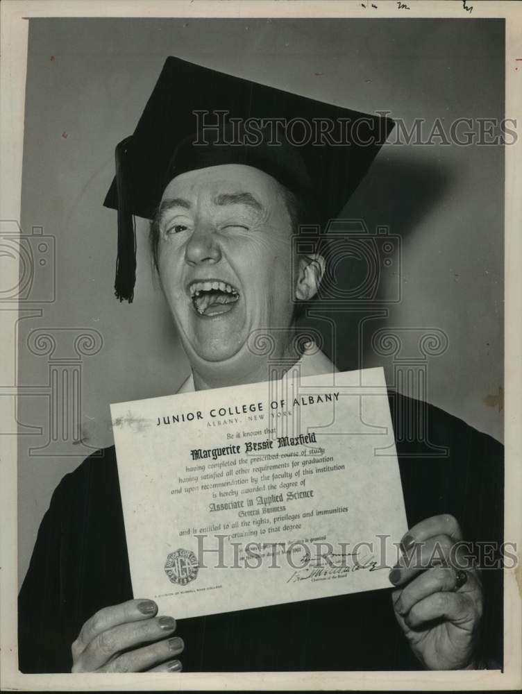 1961 Marguerite Maxfield shows off college degree in Albany, NY - Historic Images