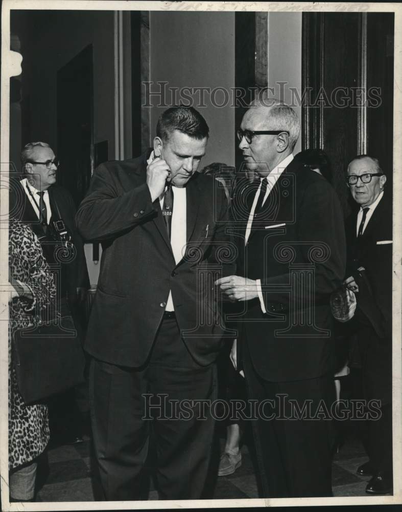 1965 Attorney E. Stewart Jones talks to colleague in Troy, New York - Historic Images