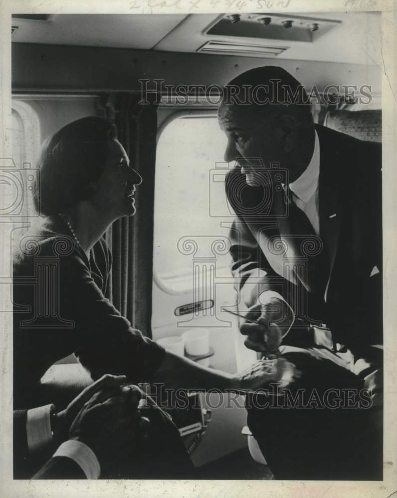 1968 US President Lyndon B. Johnson aboard airplane - Historic Images