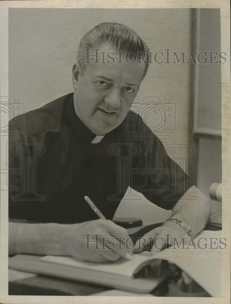 1968 Monsignor John L. Jones in his Albany, New York office - Historic Images