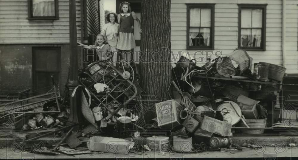 Family with scrap iron pile on Livingston Avenue, Albany, New York - Historic Images