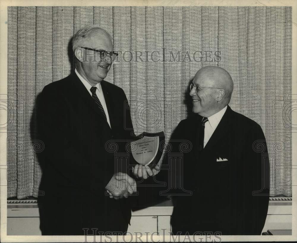 1967 Press Photo J. Burch McMorran presents award to Bernard Lefeve in New York- Historic Images