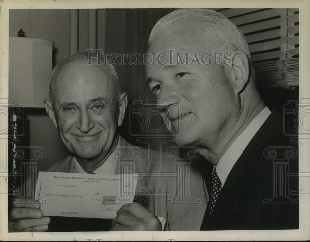 1963 Press Photo Bank chairman donates to International Center in Albany, NY - Historic Images