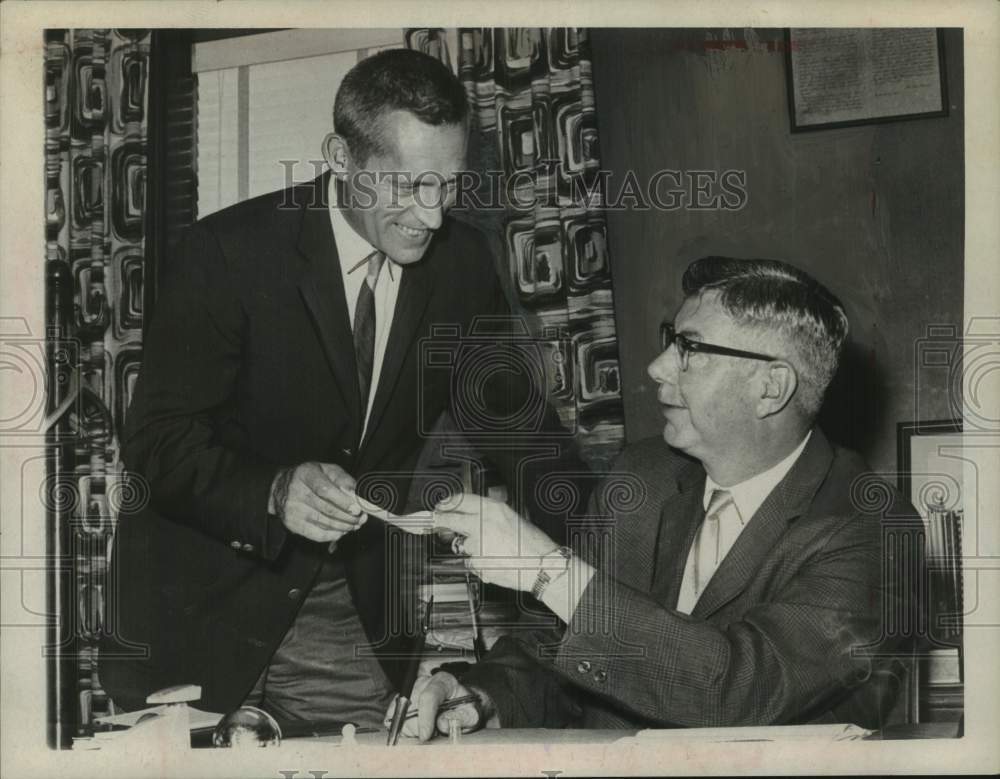 1967 Press Photo Joseph Roulier presents donation check to colleague in New York - Historic Images