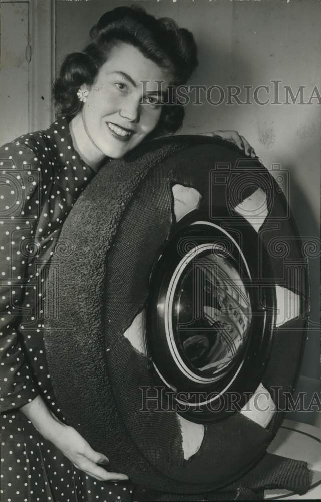 1942 Kay Scully with auto tire prototype at US Rubber, Detroit, MI - Historic Images