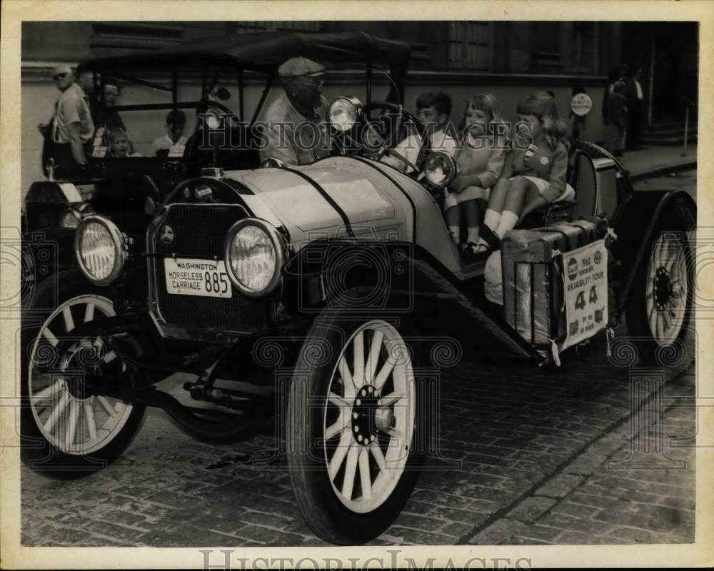 1968 Kids sit in antique 1914 Overland automobile in New York-Historic Images