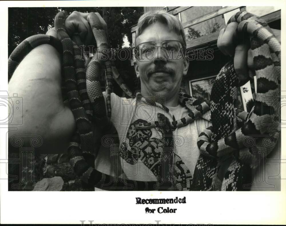 1992 Press Photo Larry Krajkowski with some of his snakes in Nassau, New York - Historic Images