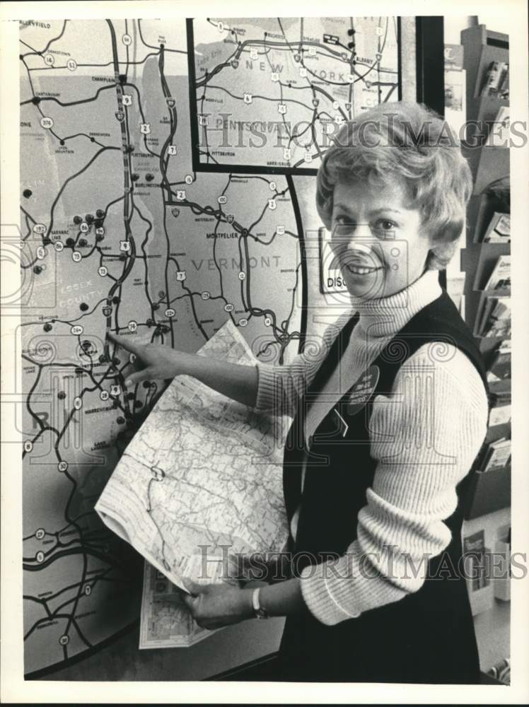 1974 Mrs. Betty Baker with maps at New York travel office - Historic Images