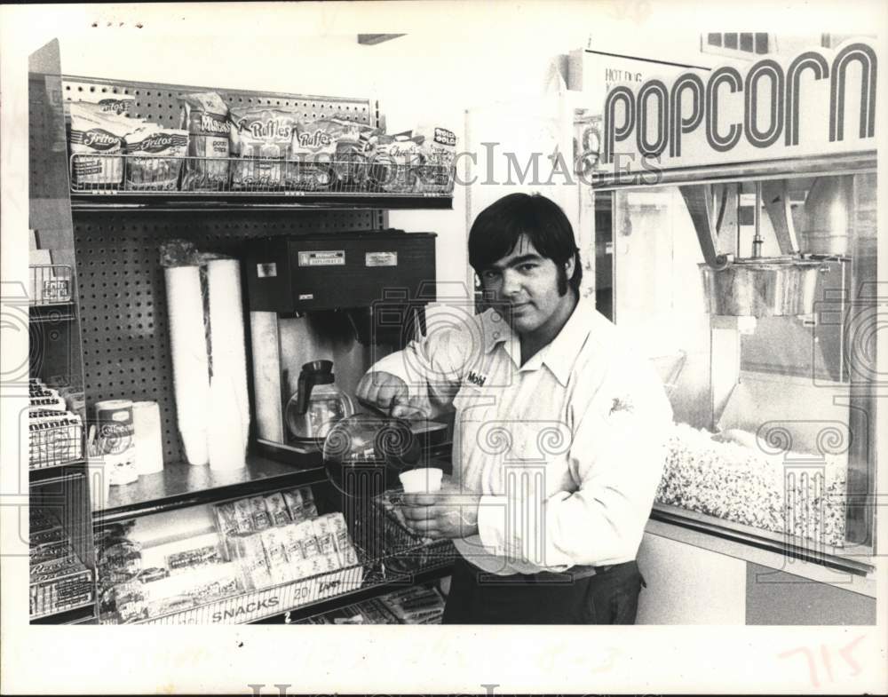 1978 Edward Anthony Allegretti pours coffee at New York gas station - Historic Images