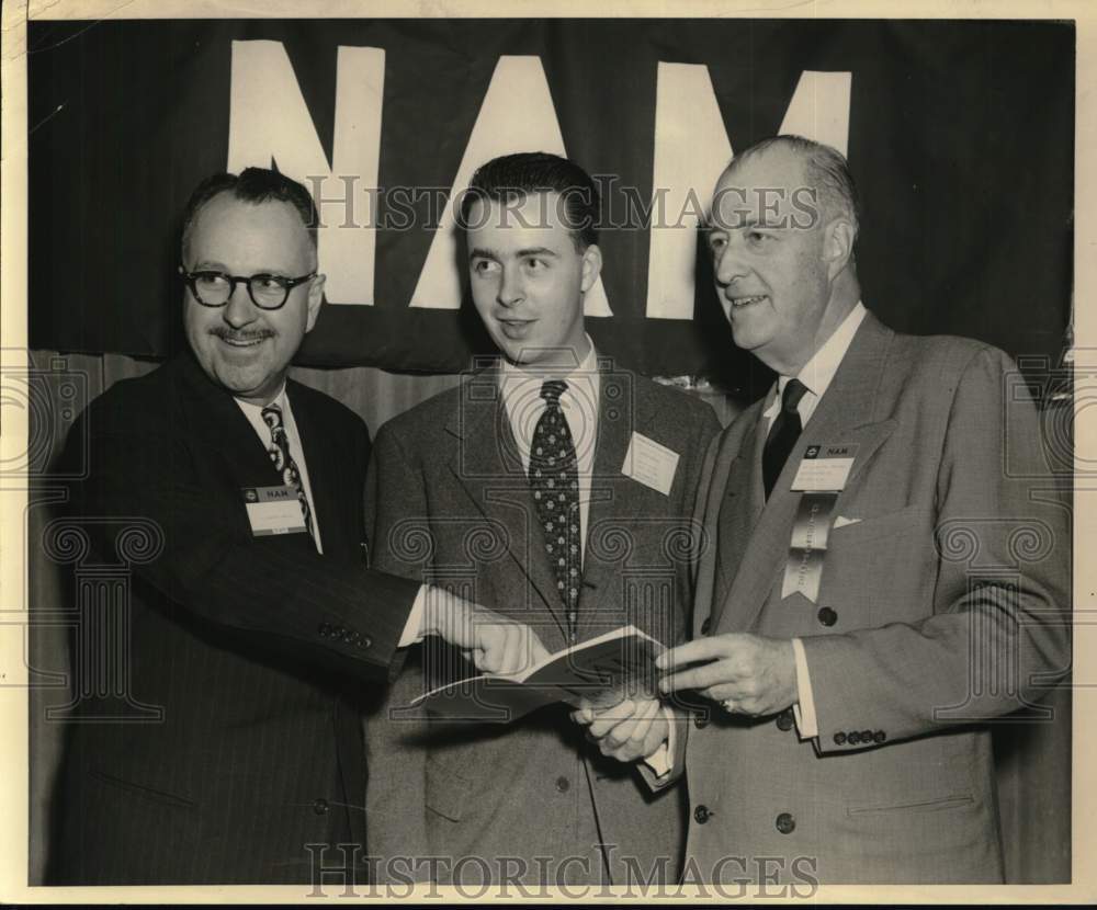 1951 NAM convention delegates look over program in New York-Historic Images