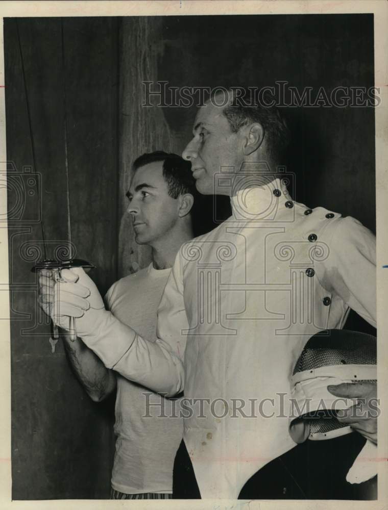 1962 Press Photo Konrad Bothe teaches fencing to Edmond Rice in Albany, New York- Historic Images