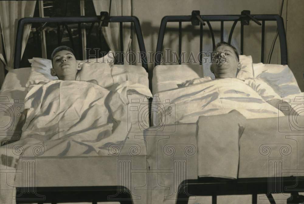 1950 Robert Layman & Lewis Bacholtz laying in New York hospital beds-Historic Images