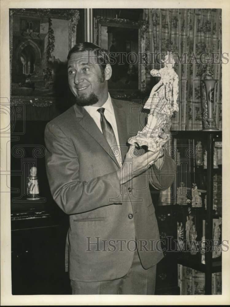 1968 Charles B. Charles holds up antique figure in New York-Historic Images