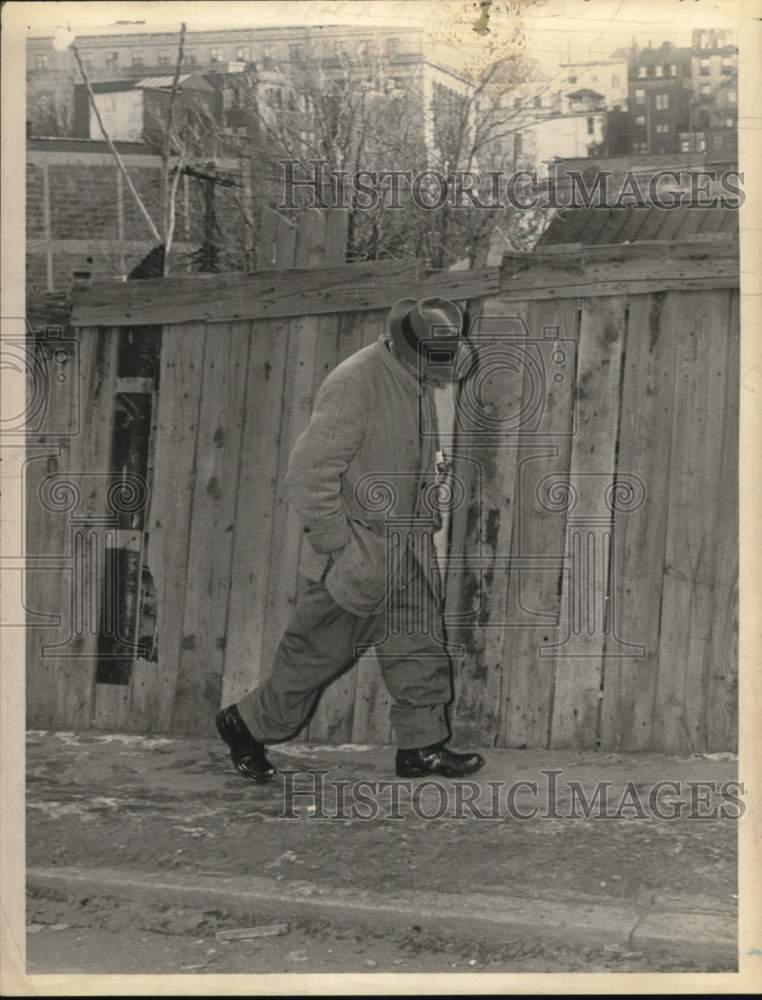 1965 Man walking along sidewalk in impoverished area of New York-Historic Images