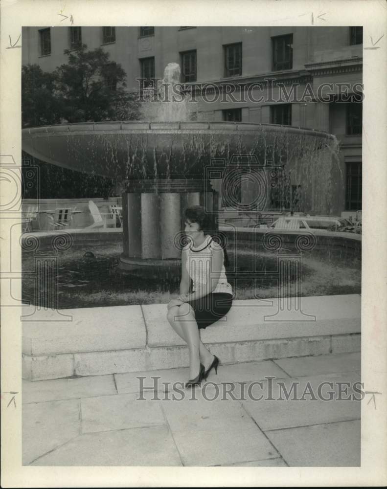 1967 Elaine Carmody sits next to fountain in Washington, DC-Historic Images