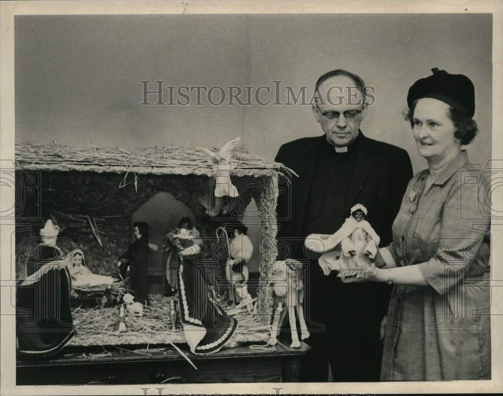 1964 Acolyte Adams & Mrs. Frederick Comstock with creche in New York-Historic Images