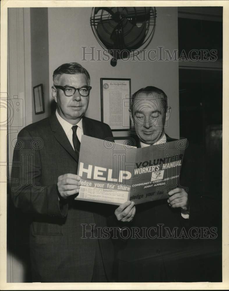 1962 Joseph Feily &amp; Joe Murphy read pamphlet in New York-Historic Images