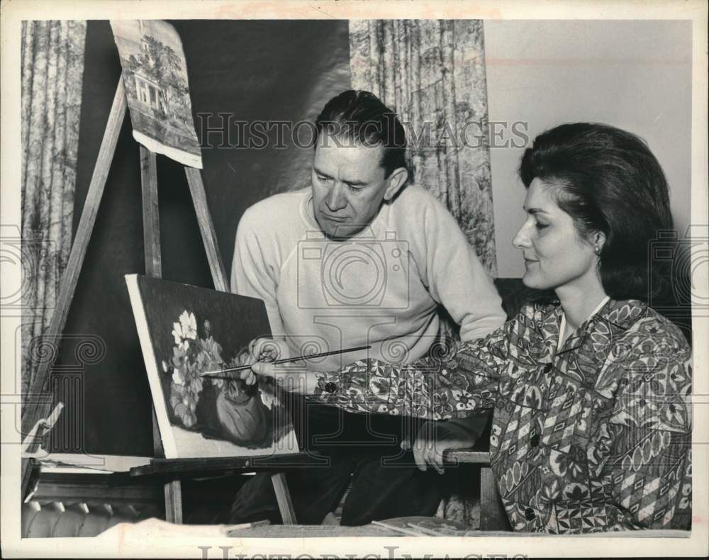 1964 Rudy Helmo watches Mrs. George Van Voorhis paint in New York-Historic Images