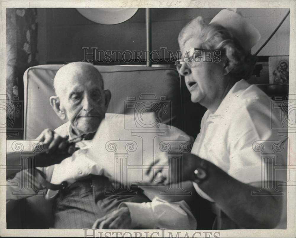 1967 Nurse reads to patient on his birthday in Albany, New York-Historic Images