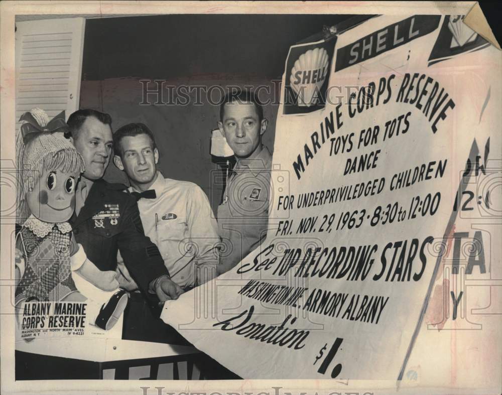 1963 Officials unveil Toys for Tots campaign poster in New York-Historic Images